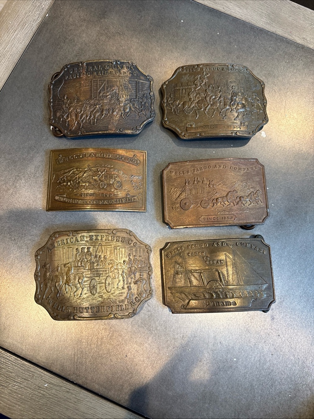 Vintage Wells Fargo brass belt buckles. 6 in total .